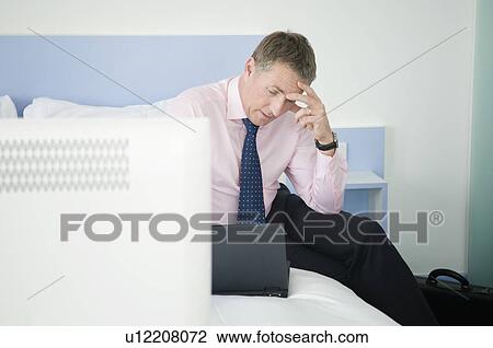 A portrait of a stressed businessman View Large Photo Image Stock Image - A portrait of a stressed businessman. Fotosearch