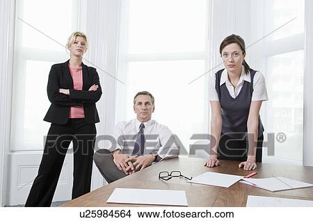 A portrait of three businesspeople View Large Photo Image Picture - A portrait of three businesspeople. Fotosearch