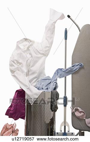 A shirt emerging from the wash basket View Large Photo Image Stock Photo - A shirt emerging from the wash basket. Fotosearch