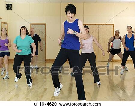 Stock Image - aerobic exercise at gym. Fotosearch
