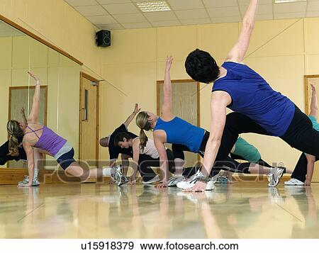 Stock Photo - aerobic exercise at gym. Fotosearch