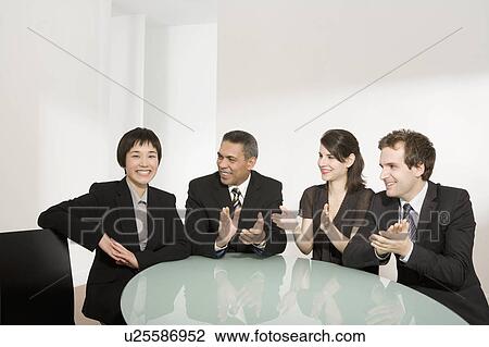 Stock Image - Applauding a colleague. Fotosearch