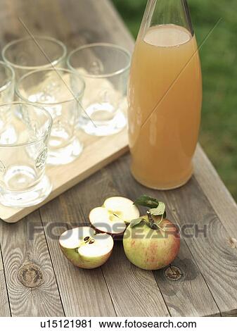 Apples, apple juice and glasses on table View Large Photo Image Stock Image - Apples, apple juice and glasses on table. Fotosearch