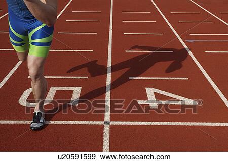 Stock Photo - athlete and shadow. Fotosearch