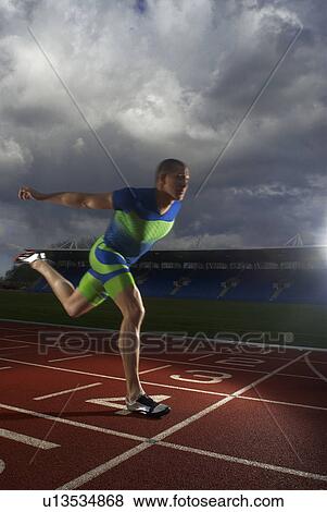 Stock Photo - athlete crossing line. Fotosearch