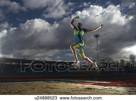 athlete doing long jump View Large Photo Image Stock Image - athlete doing long jump. Fotosearch