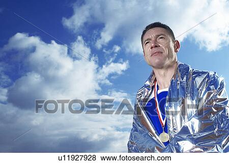 athlete in silver blanket View Large Photo Image Stock Photo - athlete in silver blanket. Fotosearch
