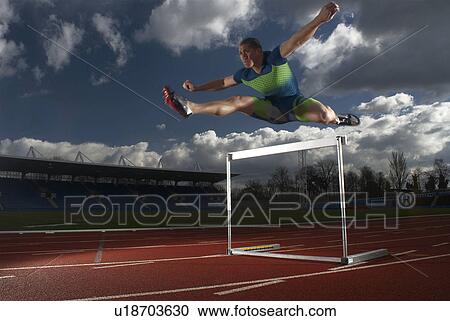 athlete jumping hurdle View Large Photo Image Stock Image - athlete jumping hurdle. Fotosearch