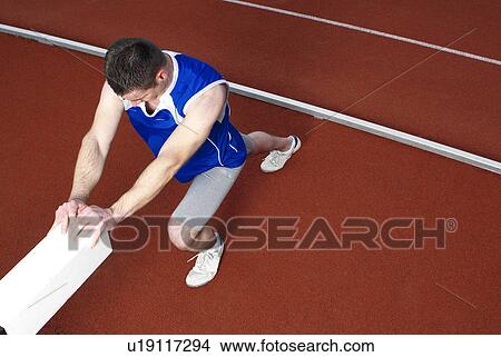 athlete stretching View Large Photo Image Picture - athlete stretching. Fotosearch
