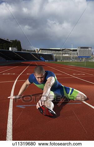 athlete stretching View Large Photo Image Stock Image - athlete stretching. Fotosearch