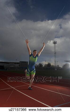 Stock Photograph - athlete winning race. Fotosearch