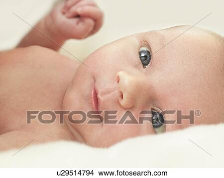 Baby in bed View Large Photo Image Picture - Baby in bed. Fotosearch