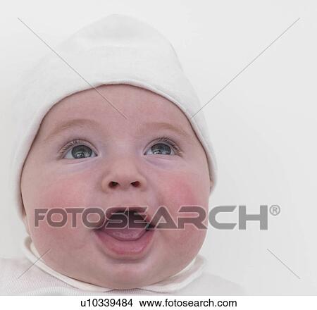 Picture - Baby smiling with mouth open, close-up. Fotosearch