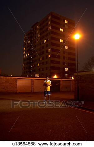 Stock Photo - basketball player at night. Fotosearch