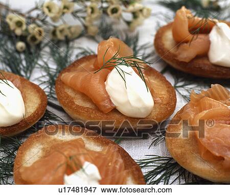 Stock Photo - blinis with smoked salmon and sour cream. Fotosearch