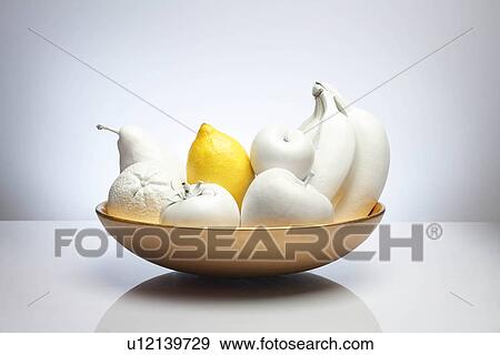 Stock Photo - bowl of white fruit with lemon. Fotosearch