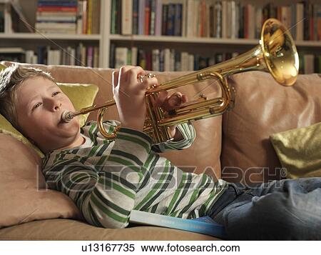 Boy, 11 playing trumpet View Large Photo Image Stock Photography - Boy, 11 playing trumpet. Fotosearch