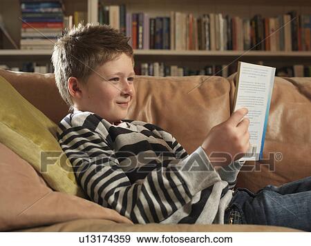 Stock Photo - Boy, 11 reading. Fotosearch