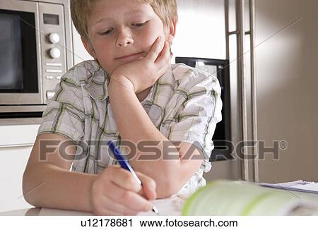 Boy 11, studying at home View Large Photo Image Stock Image - Boy 11, studying at home. Fotosearch
