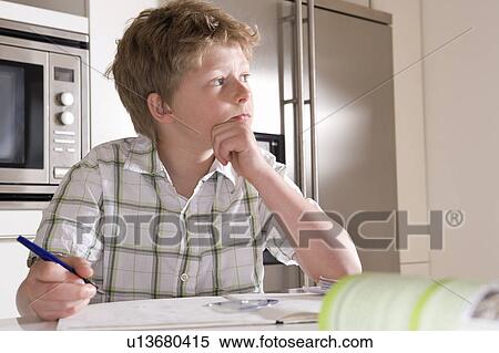 Boy 11, studying at home View Large Photo Image Stock Photography - Boy 11, studying at home. Fotosearch