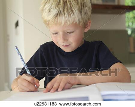 Stock Image - Boy 7 pulling silly face. Fotosearch