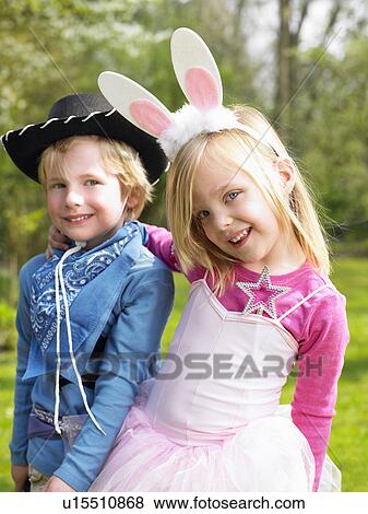 Stock Photo - Boy and girl wearing costumes. Fotosearch
