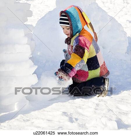 boy building igloo in the snow View Large Photo Image Stock Photography - boy building igloo in the snow. Fotosearch