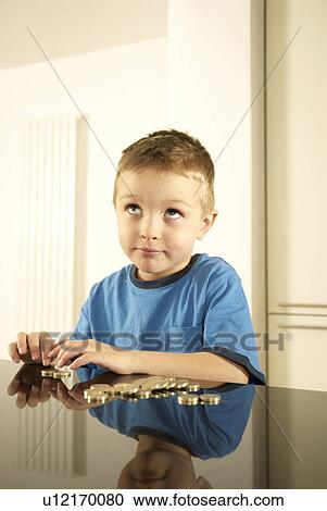 Stock Image - boy counting money. Fotosearch