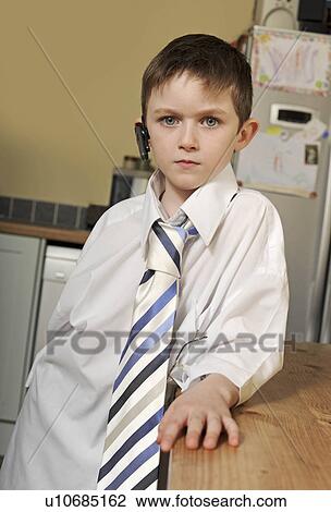 Boy dressed as business man View Large Photo Image Stock Image - Boy dressed as business man. Fotosearch