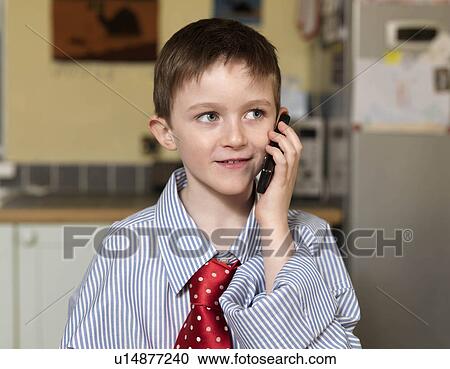 Stock Image - Boy dressed as business man. Fotosearch