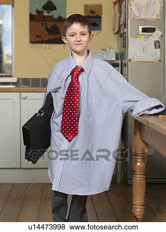 Boy dressed as business man View Large Photo Image Stock Photo - Boy dressed as business man. Fotosearch
