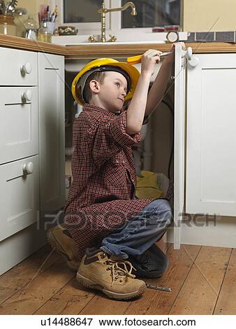 Boy dressed as repair man View Large Photo Image Stock Photo - Boy dressed as repair man. Fotosearch