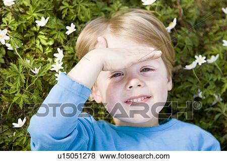 boy lying in grass View Large Photo Image Stock Photo - boy lying in grass. Fotosearch