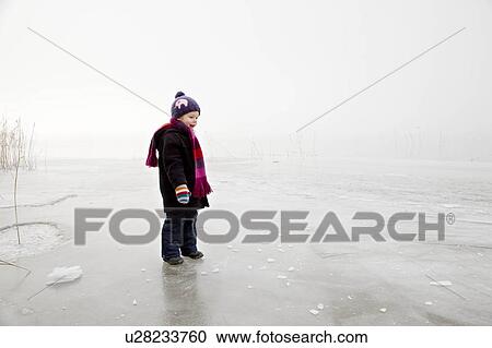 boy on frozen lake in the fog View Large Photo Image Stock Image - boy on frozen lake in the fog. Fotosearch