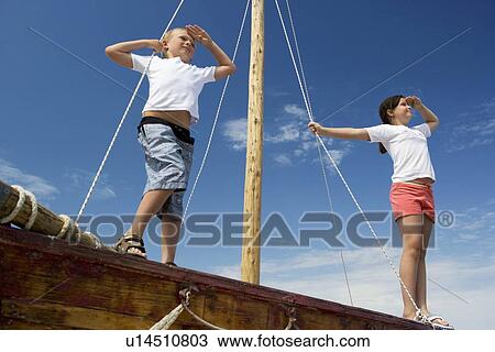 Boy on sailing boat View Large Photo Image Stock Image - Boy on sailing boat. Fotosearch
