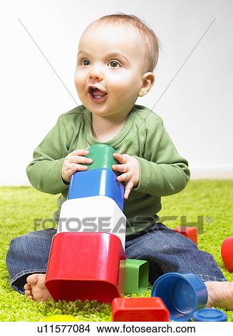 Picture - Boy playing with cubes. Fotosearch