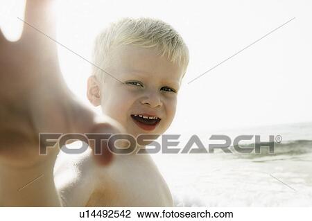 Boy reaching out to camera View Large Photo Image Stock Image - Boy reaching out to camera. Fotosearch
