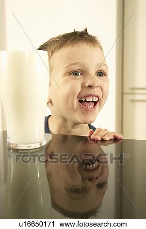 boy smiling with milk View Large Photo Image Stock Image - boy smiling with milk. Fotosearch