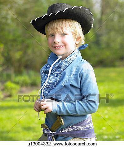 Boy wearing a cowboy costume View Large Photo Image Stock Image - Boy wearing a cowboy costume. Fotosearch