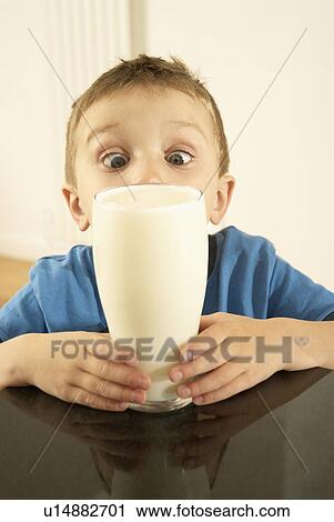 Stock Image - boy with milk. Fotosearch