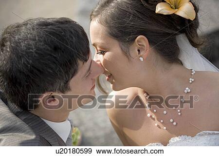 Bridal couple almost kissing. View Large Photo Image Stock Photo - Bridal couple almost kissing.. Fotosearch