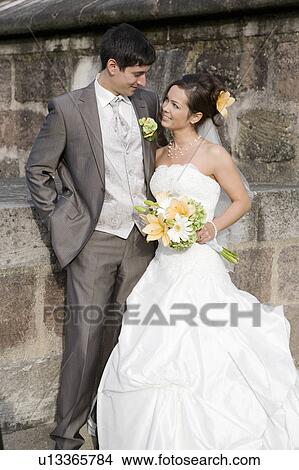 Picture - Bride & groom looking at each other.. Fotosearch