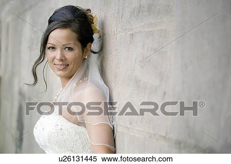 Bride leaning to wall. View Large Photo Image Stock Photography - Bride leaning to wall.. Fotosearch