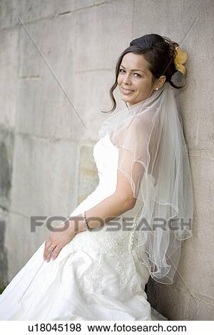Bride posing in her wedding dress. View Large Photo Image Stock Photo - Bride posing in her wedding dress.. Fotosearch