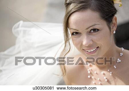 Bride smiling at a camera. View Large Photo Image Stock Image - Bride smiling at a camera.. Fotosearch