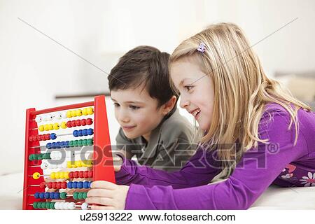 brother and sister playing with abacus View Large Photo Image Stock Image - brother and sister playing with abacus. Fotosearch