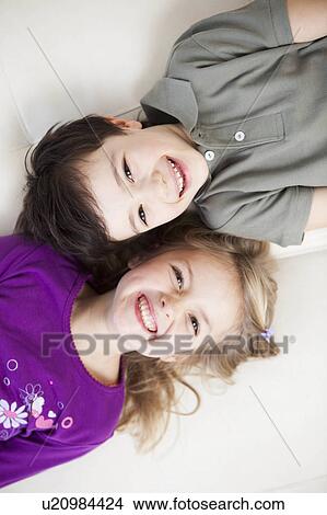 brother and sister smiling at camera View Large Photo Image Picture - brother and sister smiling at camera. Fotosearch
