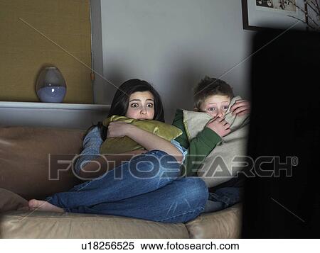 Brother and sister watching scary movie View Large Photo Image Stock Photography - Brother and sister watching scary movie. Fotosearch