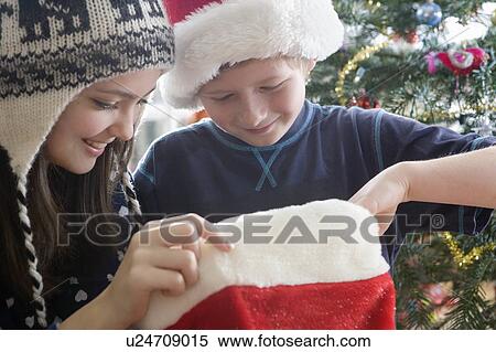 Brother and sister with stocking View Large Photo Image Stock Photography - Brother and sister with stocking. Fotosearch