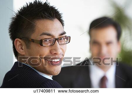 Business colleagues in a lobby View Large Photo Image Stock Image - Business colleagues in a lobby. Fotosearch